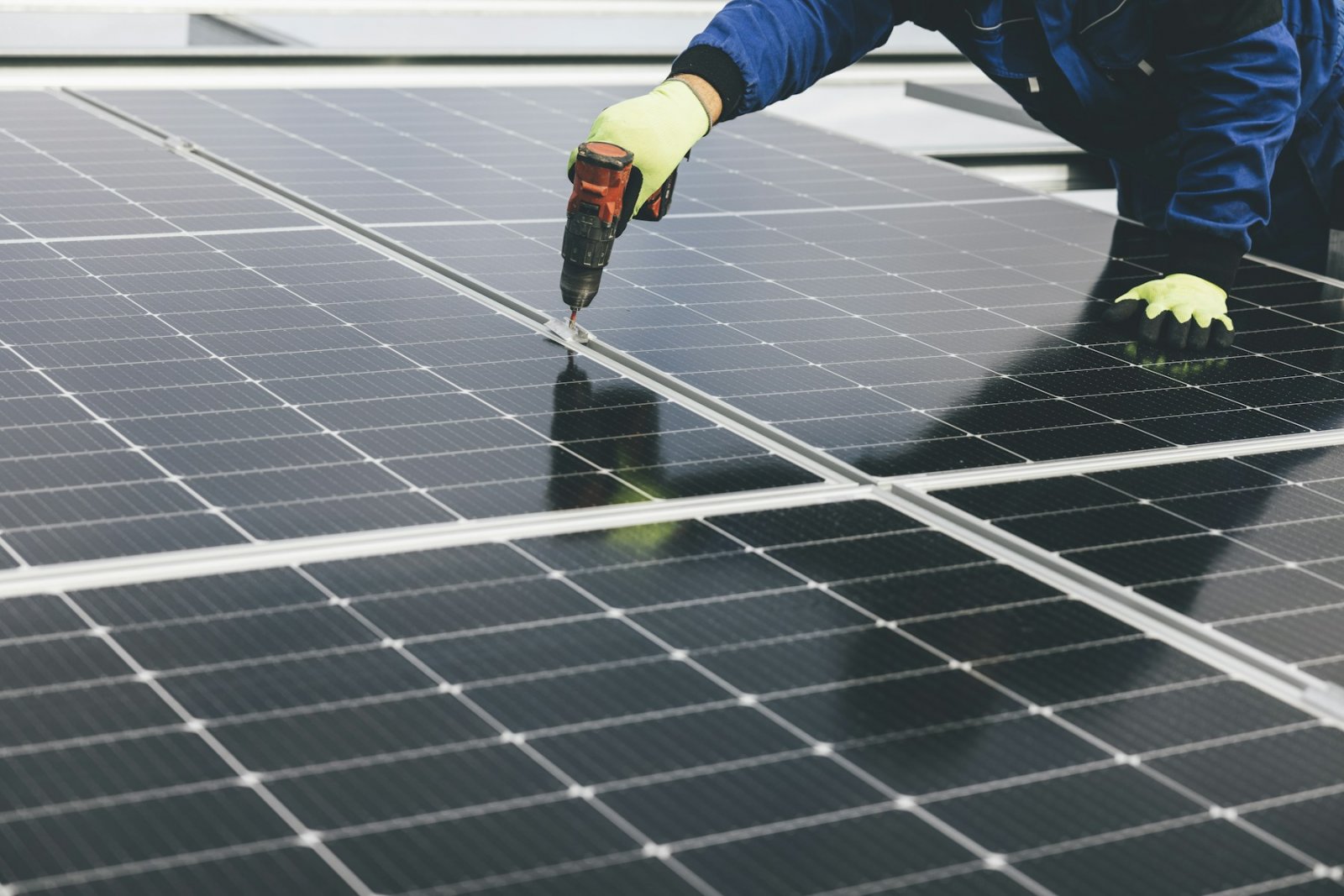 Technician working on a solar panel array