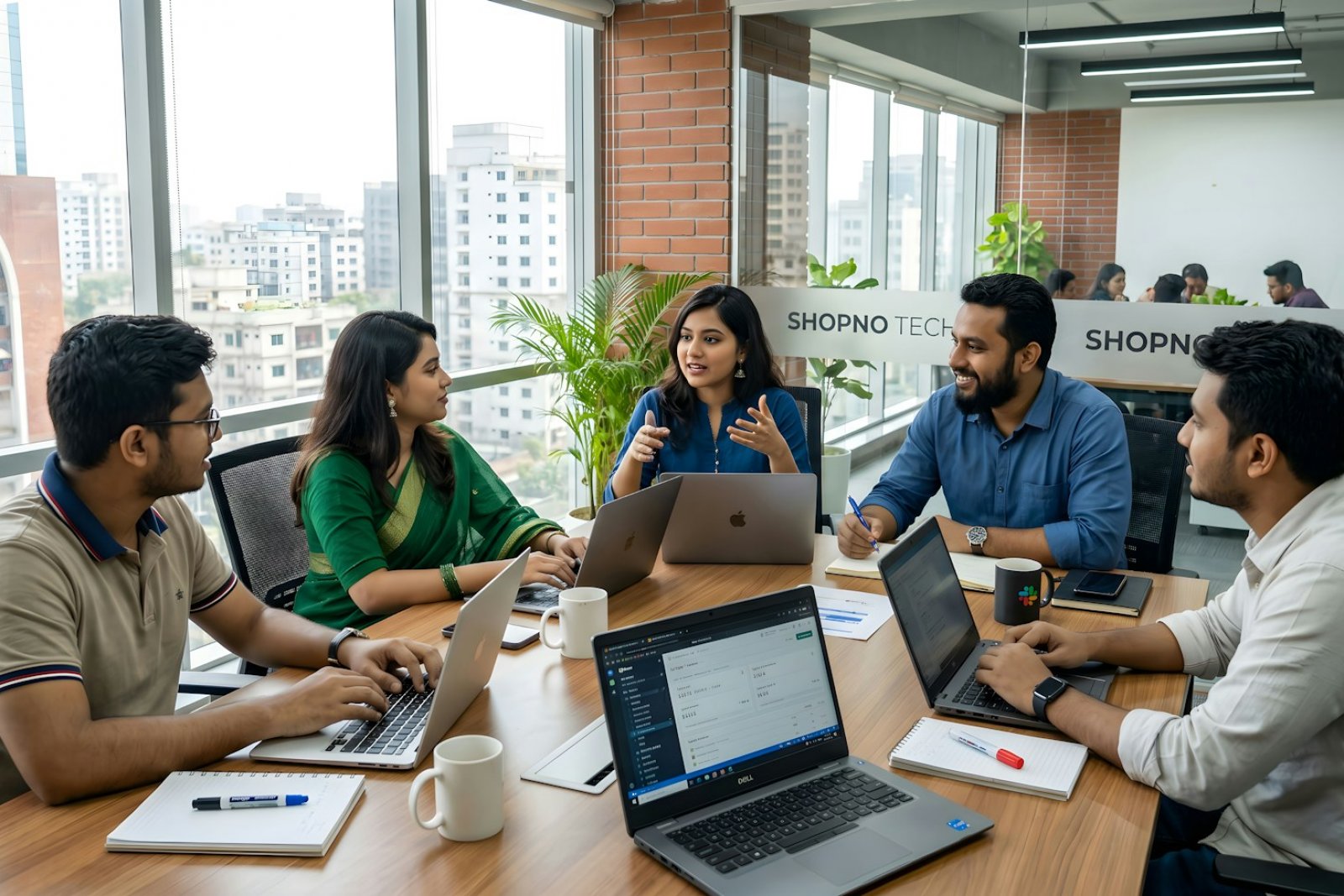 Colleagues working together at a table in a modern office